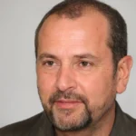 Best Garage Floor Epoxy Austin TX - Free Quote 24/7 5 Man standing in a well-lit space.